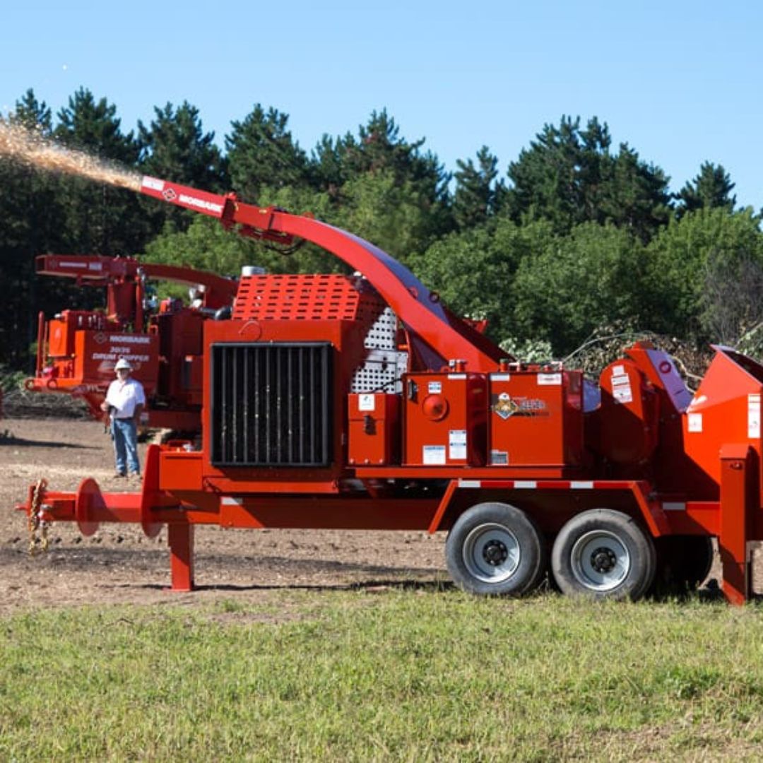 Morbark forestry wood chipper working through large logs