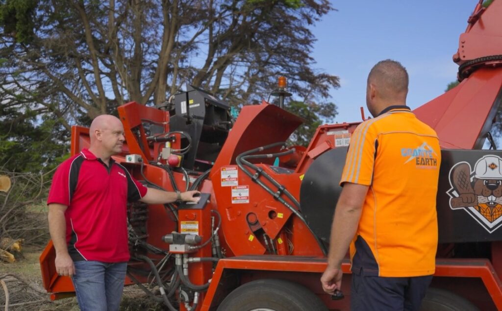 Monitor sales manager talking with customer about the 2230 morbark wood chipper.